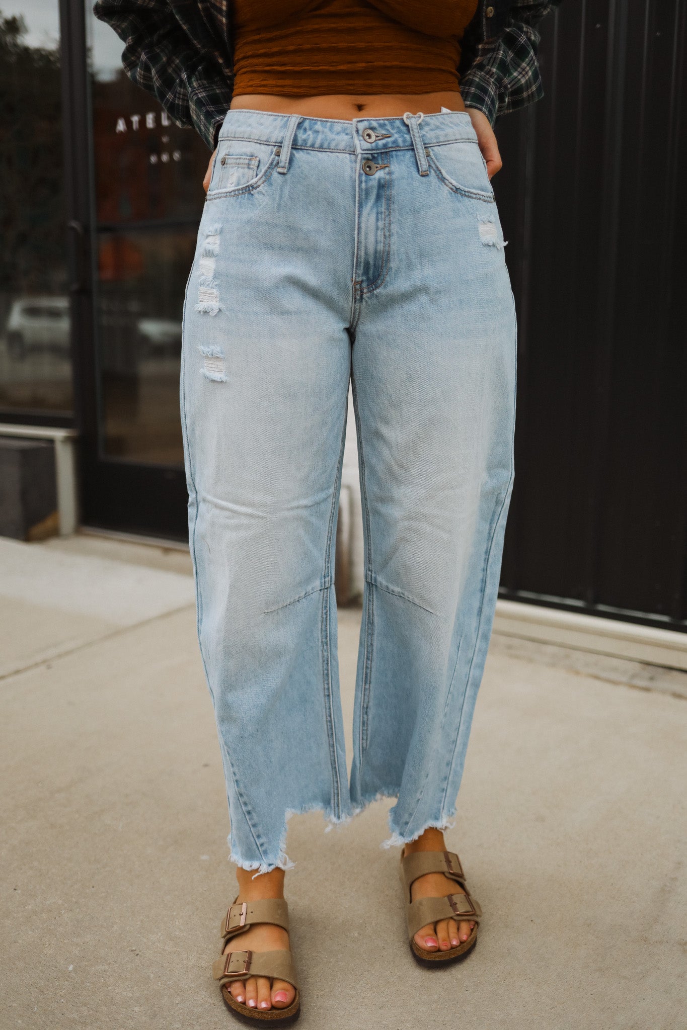 These jeans feature a relaxed fit with distressed detailing, perfect for adding an edgy touch to your outfit. 