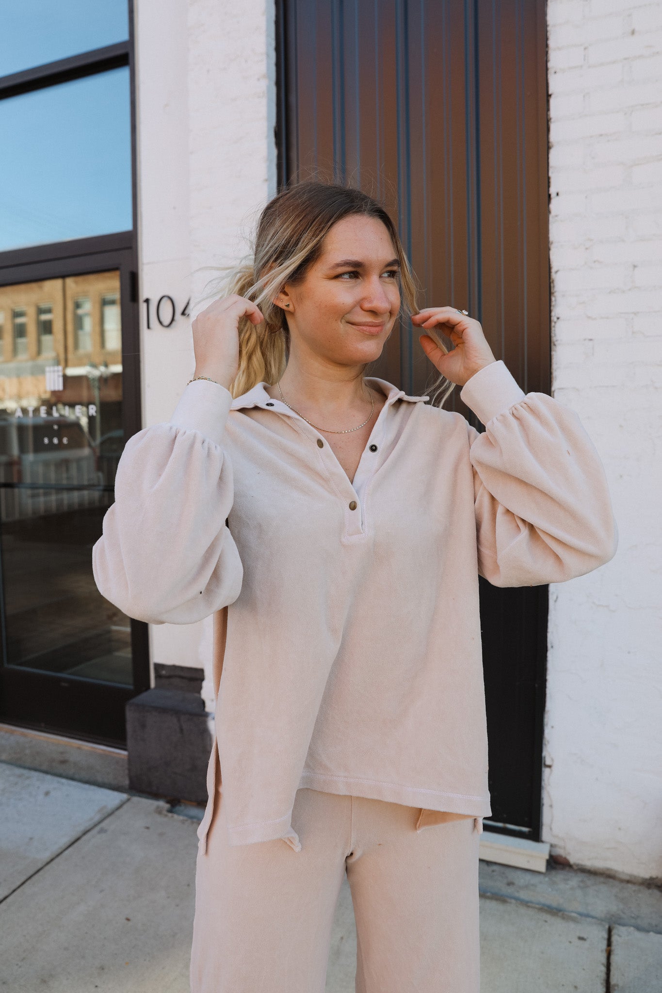 The Find Me Here Washed Collared Velour Top is your new casual must-have. It features a soft velour fabric and a relaxed fit. The little details make this one stand out, like the rib sleeve cuffs, collared neckline, a half placket with antiqued brass snaps down it, and side slits.
