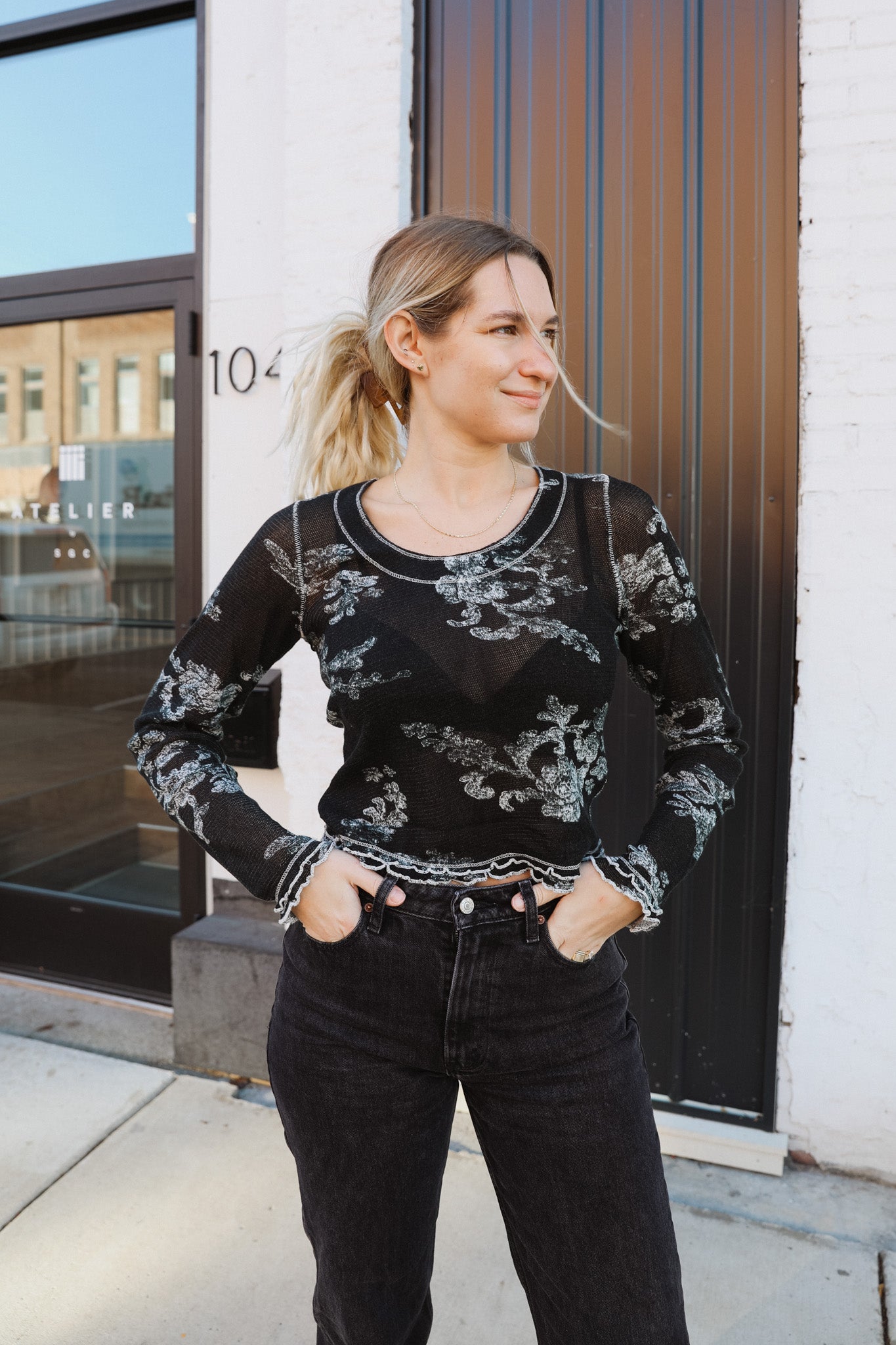 So sweet and staple in a stunning floral print, this forever classic long sleeve tee is featured in a timeless knit fabrication with defined seaming and neckline and lettuce-style trim for added dimension.