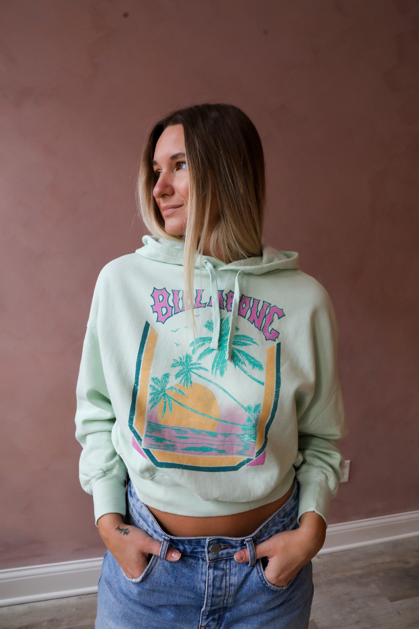 Cropped and cozy, the All Time Hoodie from Billabong's Trip Around The Sun collection is crafted of blended cotton fabric for a super-soft feel. This sweatshirt has a boxy fit with assorted graphics on the chest and ribbing at the cuffs and bottom hem.